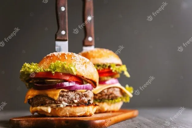 two-mouth-watering-delicious-homemade-burger-used-to-chop-beef-on-the-wooden-table-the-burgers...jpg