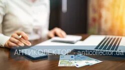 woman-working-with-finances-table-laptop-smartphone-money-notepad.webp